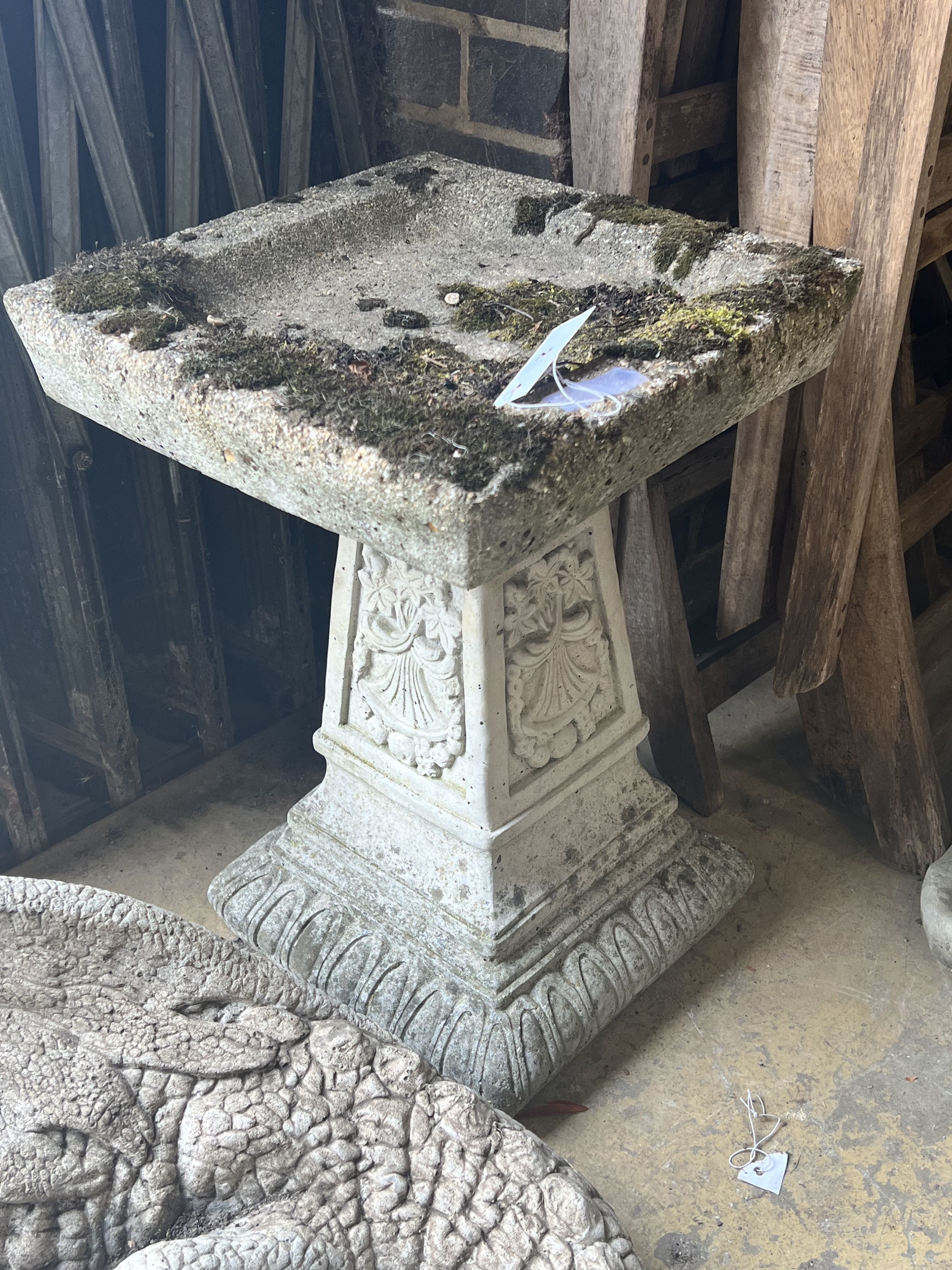 A reconstituted stone square garden bird bath, width 36cm height 54cm